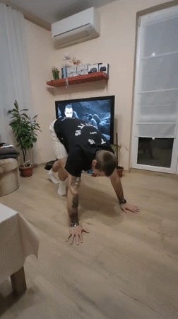 Man performs calisthenics workout in Varna living room