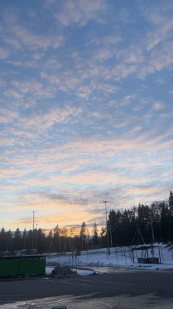 Winter sunset captured over Lupanovo, Russia countryside