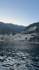 Boat passenger films Amalfi Coast town from water