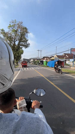 Motorcycle ride recorded on rural Indonesian road