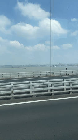 Vehicle crosses bridge in Yangzhong as SUV passes nearby