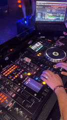 Late-night DJ set under purple and blue lights in Tiraspol