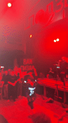 Five-piece band performs live concert in Novosibirsk under red lights