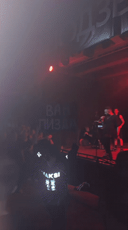 Five-piece band performs live concert in Novosibirsk under red lights