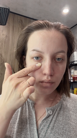 Woman photographed during morning routine in Reshetnikovo bathroom