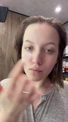 Woman photographed during morning routine in Reshetnikovo bathroom