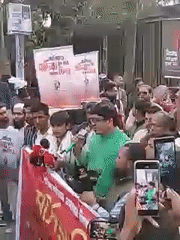 Protest with red banners held in Dhaka streets