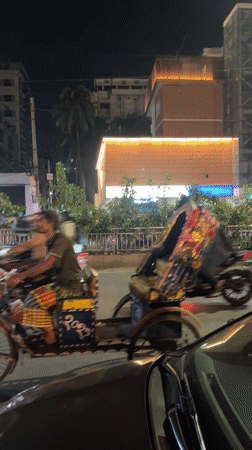 Evening street life captured in busy Dhaka commercial district