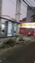 Evening ride through decorated Surabaya streets near an overpass