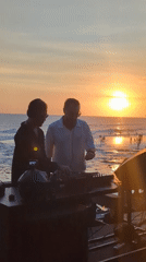 Sunset beach gathering with DJs and activities in North Kuta