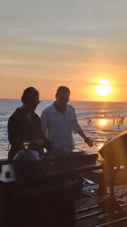 Sunset beach gathering with DJs and activities in North Kuta