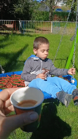 Morning coffee break at Dobrich playground swing set