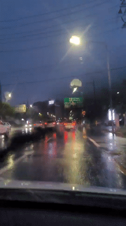 Rainy evening drive through Jeju City streets