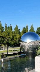 Reflective sphere sculpture draws visitors in Krasnodar park