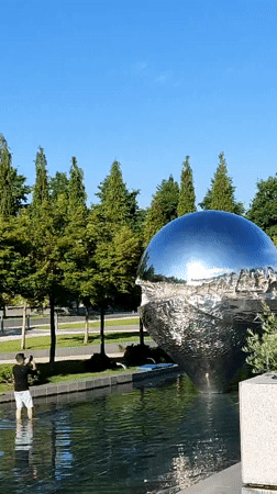 Reflective sphere sculpture draws visitors in Krasnodar park