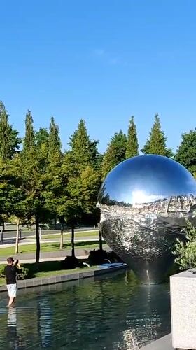 Reflective sphere sculpture draws visitors in Krasnodar park
