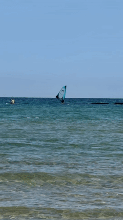 Serene morning captured at Bat Yam coast with windsurfing activity