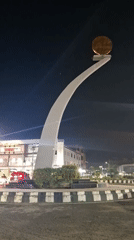 Evening life documented around Lhokseumawe monument and homes