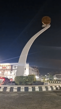 Evening life documented around Lhokseumawe monument and homes