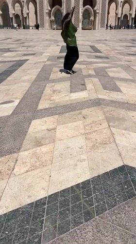 Visitors explore Hassan II Mosque plaza in Casablanca