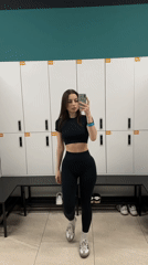 Woman takes mirror selfies in Moscow gym locker room