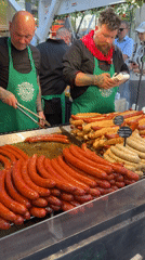Food vendors serve customers at busy Budapest outdoor market