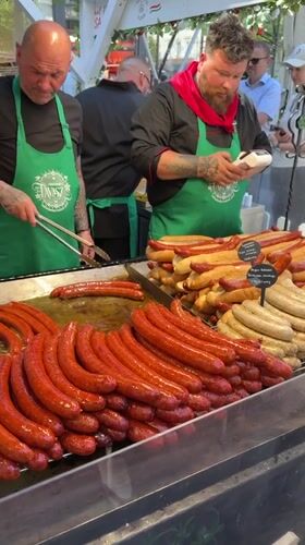 Food vendors serve customers at busy Budapest outdoor market