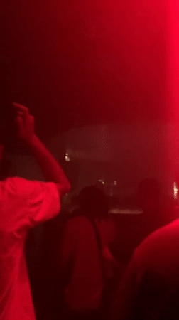 Late-night DJ set at a darkened Tel Aviv club
