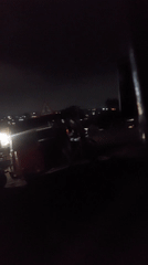 Three tuk-tuks parked on Dar es-Salaam street at night