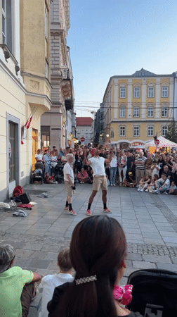 Breakdancing and acrobatics draw crowds in a Linz plaza