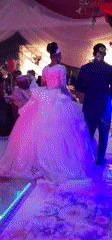 Wedding celebration with DJ, decorative lighting captured by witness