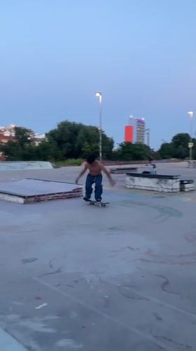 Skateboarder practices tricks at graffiti-covered Badalona skatepark