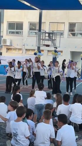 Teenagers perform dance routine in Netanya schoolyard