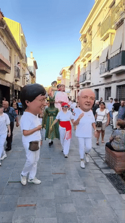 Traditional giant puppet festival procession held in Ripollet, Spain