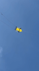 Stunt kite flies over tropical beach in Weligama, Sri Lanka