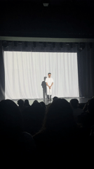 White-clad performer appears on stage in Yerevan