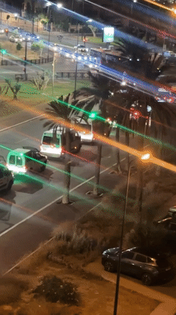 Convoy of lit vans observed traveling through Marrakesh at night