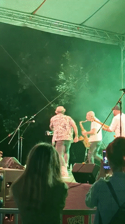 Live outdoor band performance caught from multiple angles at night