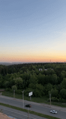 Young woman photographed during sunset in Izhevsk cityscape