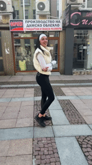 Woman walks decorated streets in Gabrovo, Bulgaria