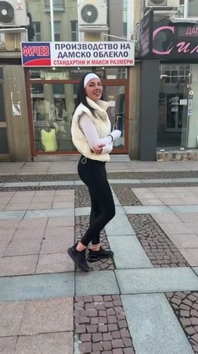Woman walks decorated streets in Gabrovo, Bulgaria