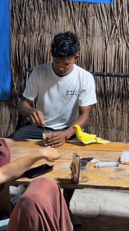 Man feeds parrot peanut butter in Maldives island setting