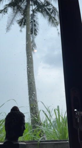 Rainy morning view through window in Kuwum, Indonesia