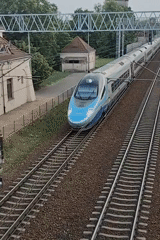 Evening at Modlin station: trains, platforms, and tracks