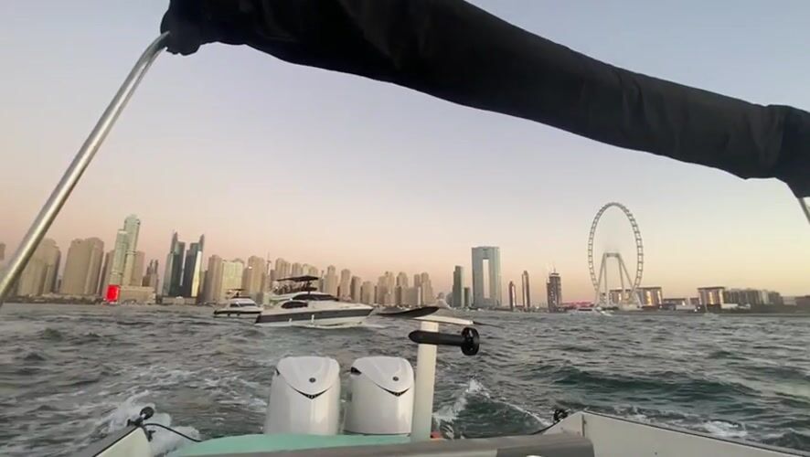 Boat captures Dubai skyline view at dusk