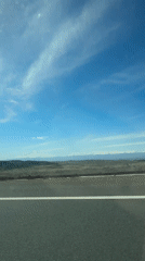 Highway journey documented through mountainous terrain with Armenian signage