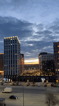 Afternoon scenes documented across Tyumen featuring buildings and Pomeranian