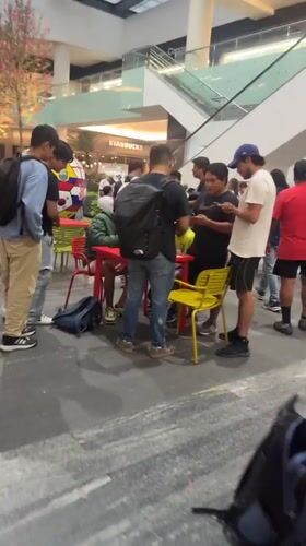 Evening crowds gather at Puebla shopping center, Coppel store
