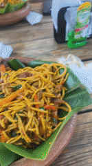 Traditional meal on banana leaf documented in Abuja