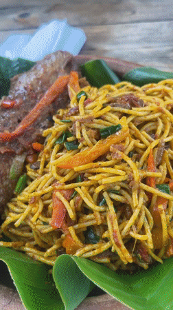 Traditional meal on banana leaf documented in Abuja